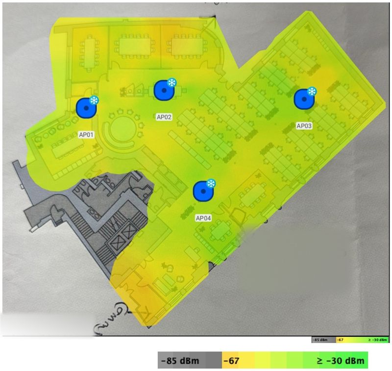 A 2.4 GHz signal strength heatmap of an office floor, showing wide overlapping coverage