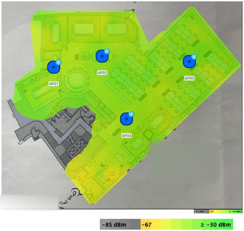 A 5 GHz signal strength heatmap over a scaled office floorplan, four access point positions marked AP01 to AP04, colour scale from minus 85 to minus 30 dBm